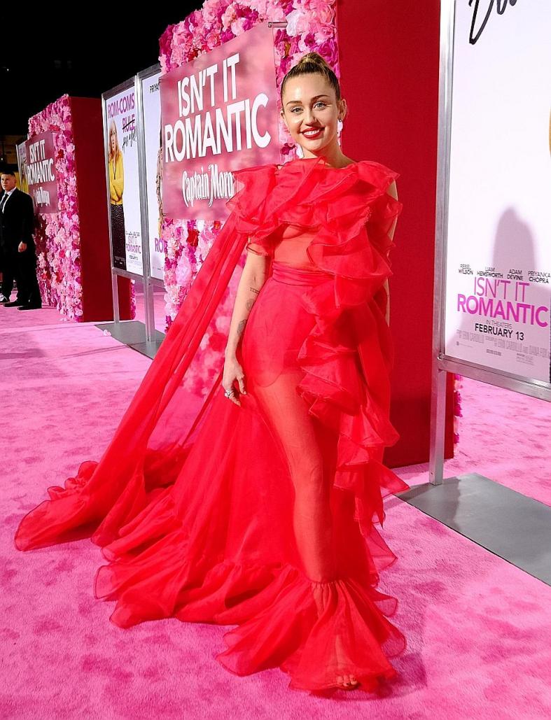 Miley Cyrus is red hot on red carpet