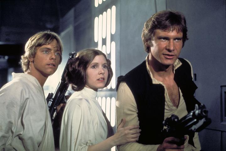 Mark Hamill as Luke Skywalker, Carrie Fisher as Princess Leia and Harrison Ford as Han Solo in Star Wars (1977)
