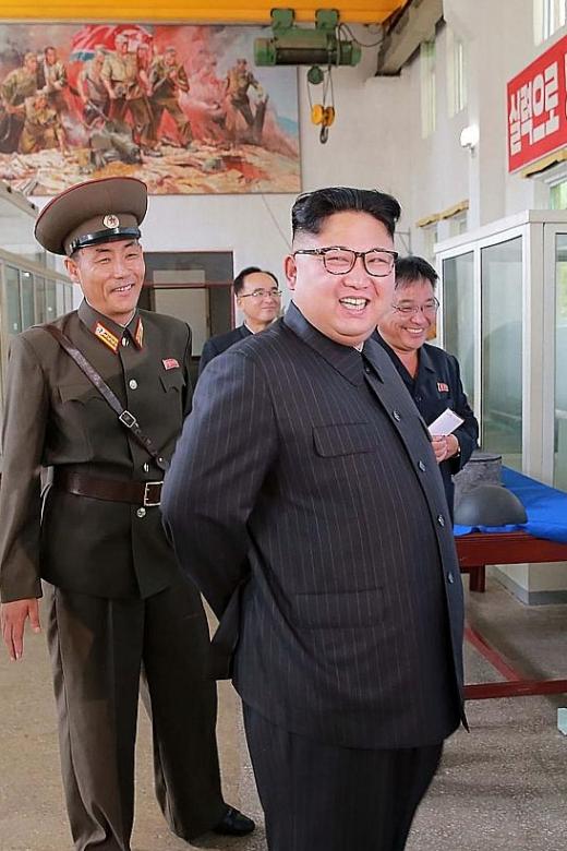 North Korea puts missile plans on show, steps up production