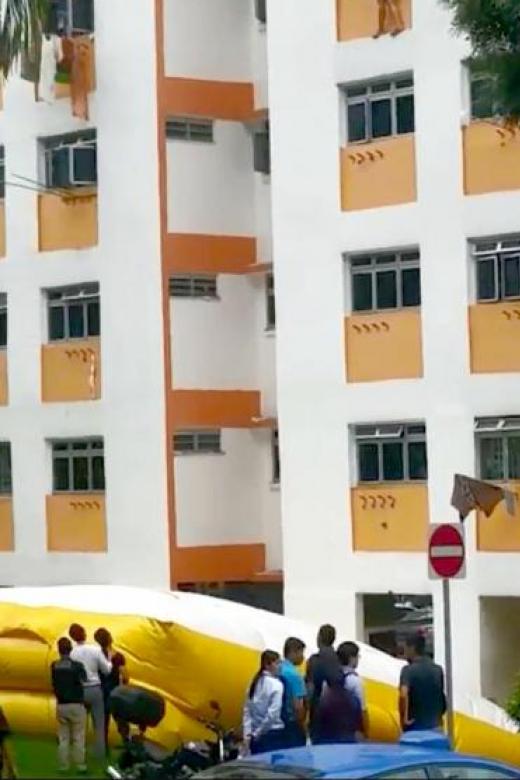 Man survives fall from fifth-storey flat