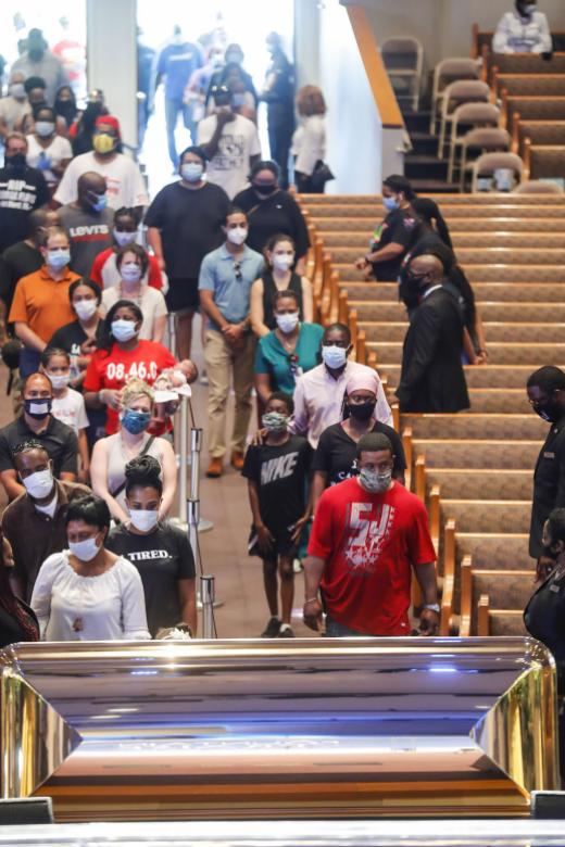Thousands view George Floyd’s casket to pay respects