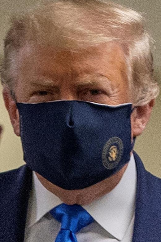 Trump finally wears mask as US posts record spike in coronavirus cases