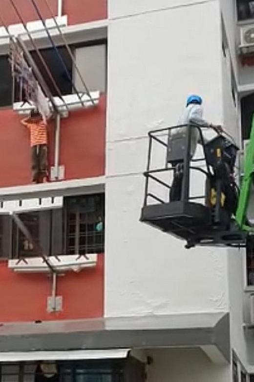 Worker saves 6-year-old boy trapped on ledge of block