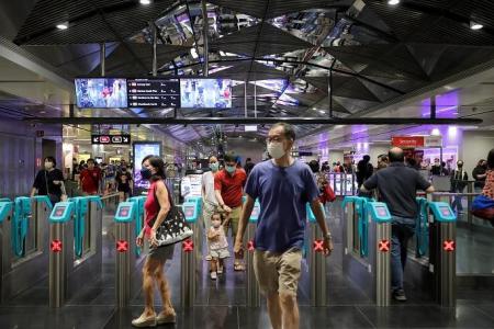 Commuters hop on MRT trains at 11 new TEL stations for free rides