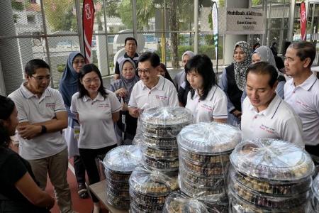 Low-income families get cookies, groceries and spruce-up for homes ahead of Hari Raya