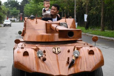 Vietnamese dad converts van into wooden tank for son