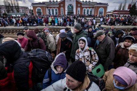 At least 20 killed in eastern Ukraine after rocket attack on train station used by evacuees