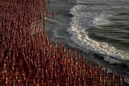 Thousands strip for art and cancer awareness on Sydney's Bondi beach