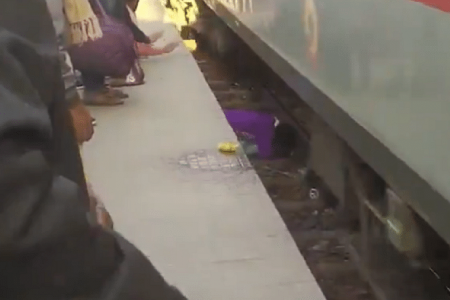 Indian woman saves her 2 kids as train went over them