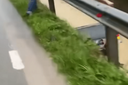 Man in Johor jumps into flooded drain to save woman clinging to car