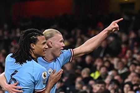 Man City go top with 3-1 statement win at Arsenal