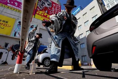 Samurai trash collectors clean Tokyo streets after Halloween revels