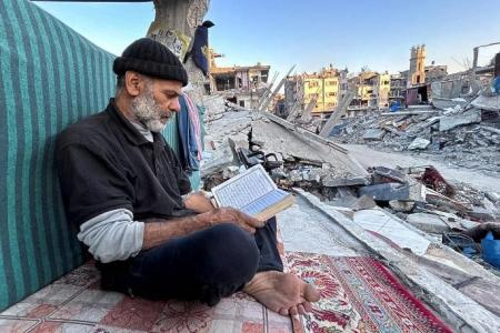 Gaza's displaced break fast with canned food in the rubble