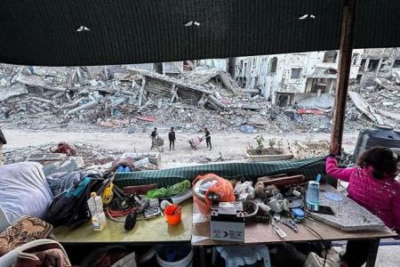 Gaza's displaced break fast with canned food in the rubble