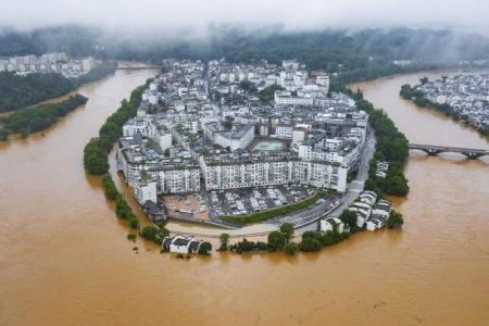 Mass evacuations in China after heaviest rains in decades