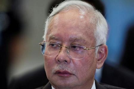 Malaysia's imprisoned ex-PM Najib retains MP status after filing for royal pardon