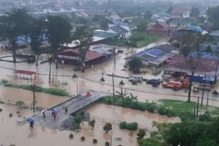 PM Ismail calls in troops to help as floods hit Malaysia, with more rain expected
