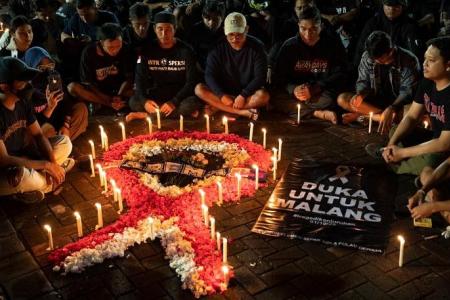 17 children among the 125 dead in Indonesia soccer stampede
