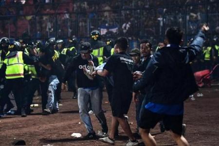 17 children among the 125 dead in Indonesia soccer stampede