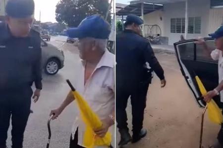Malaysians laud cops who offer a lift to elderly man walking home in the rain