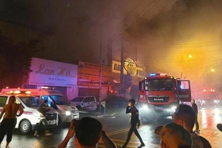 Owner of Vietnam bar arrested after blaze that killed 32