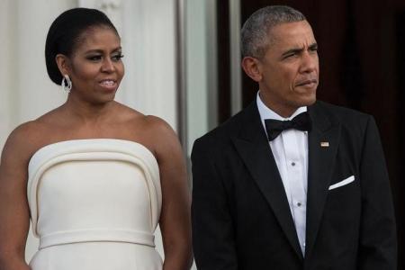 Barack and Michelle Obama return to the White House for portrait unveilings