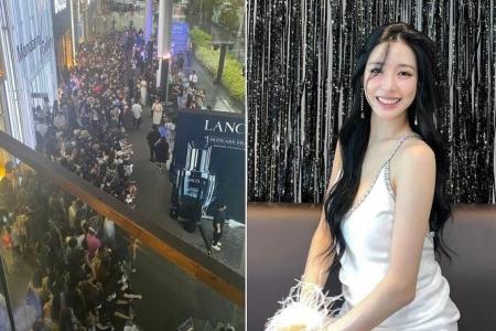 Fans turn up in the rain to see Tiffany from Girls' Generation in Orchard Road