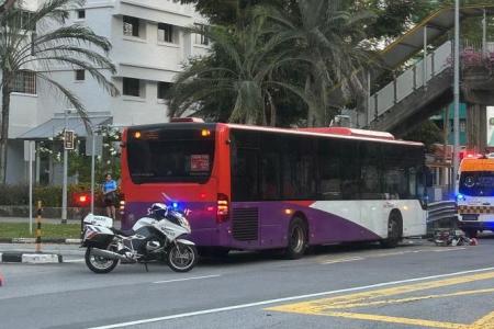 Woman cyclist taken to hospital after collision with bus