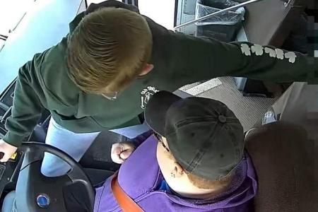 US schoolboy steers school bus to safety after driver passes out