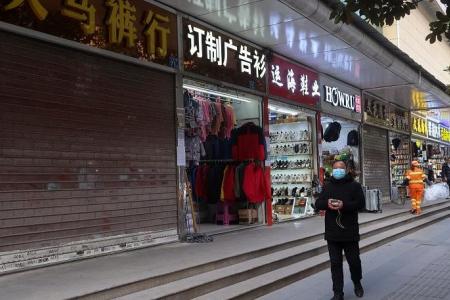 Businesses in China's Wuhan face fresh worries after easing