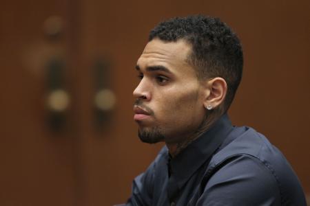  Chris  Brown trial delayed;  bodyguard convicted of misdemeanor