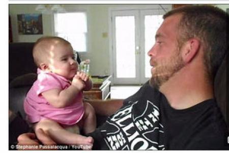 Dad almost manages to make his two-month-old girl say 'I love you'
