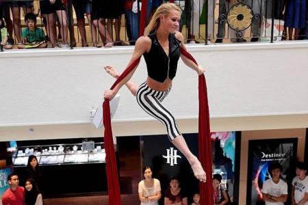 Upside-down circus act entertains shoppers at Parkway