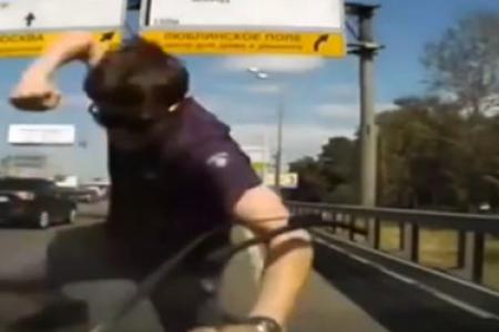 Angry driver punches car windscreen and cracks it