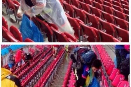 Japanese fans clear litter after match against Ivory Coast