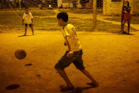Sao Paulo slum kids challenge World Cup winners to play with them