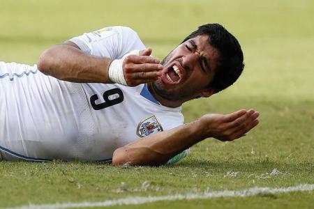 Suarez faces ban after bite on Chiellini