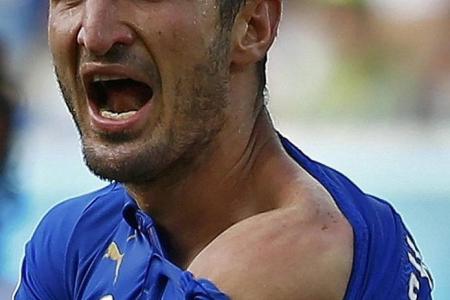 Suarez faces ban after bite on Chiellini