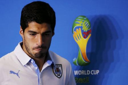 Suarez banned for 9 int'l matches and 4 months