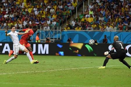 Belgium down the US in extra time to make last eight