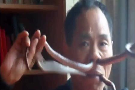 VIDEO: How did this man make a snake slither out of his nostril?