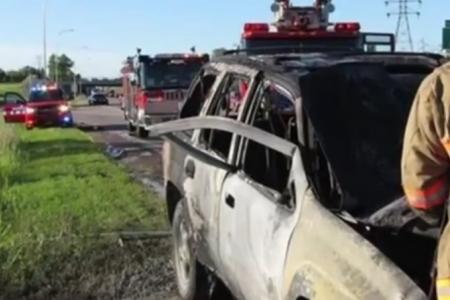 Hero uses bare hands to free driver from burning SUV