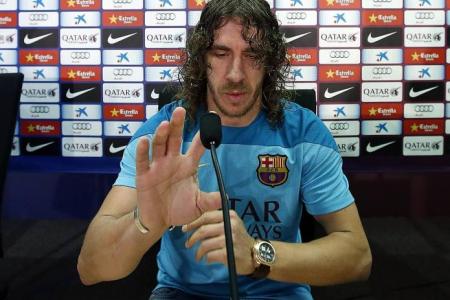 Puyol warns Suarez to behave if he moves to Barca 