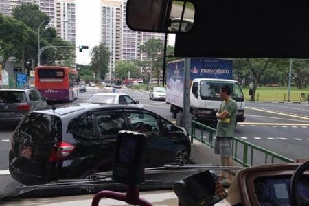 Road bully blocks SBS bus with his car