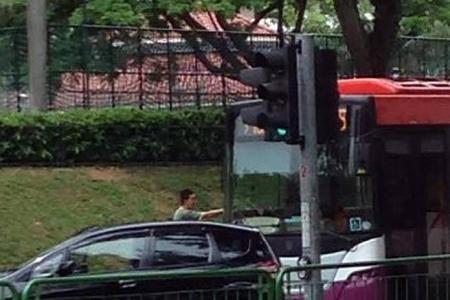 Road bully blocks SBS bus with his car