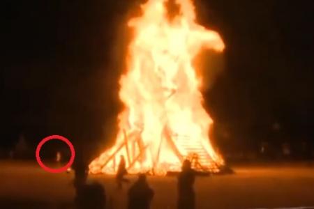 Man dies after jumping into bonfire