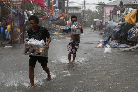 Hundreds of thousands evacuated as typhoon batters the Philippines