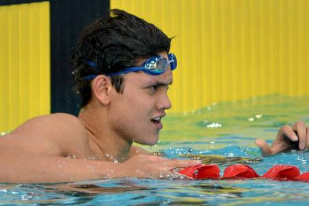Schooling sets new national record in 100m fly