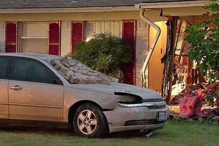 Man slams car into house after arguing with wife