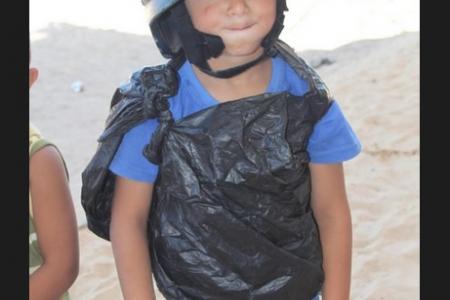 Gaza kid dons garbage bag-jacket pretending to be journalist